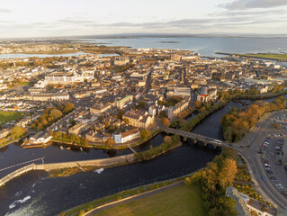 Obraz premium Aerial drone view on Galway city and river Corrib. Ireland, Cloudy sky.