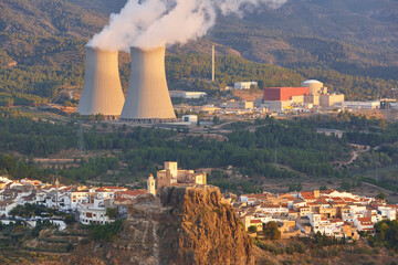 Nuclear power plant chimney and castle in Cofrentes. Valencia, Spain