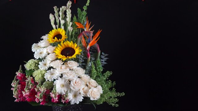 Tropical Hawaiian flower arrangement slider panning sunflower lily white roses daisy