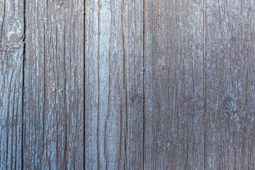 material texture of weathered wood boards with peeling blue paint