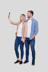 Fototapeta premium Couple Taking Selfie Isolated. Couple, Lovers, Family, Friends Concept