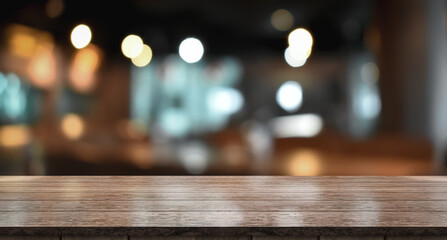 Empty wooden table top with lights bokeh on blur restaurant background