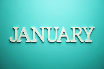 January alphabet letter on blue background