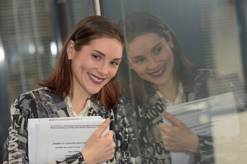 Happy business  woman is smiling at the camera