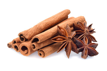 Spices cinnamon sticks, anise stars closed up isolated on white