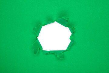 green Hole in the paper with torn sides. christmas background