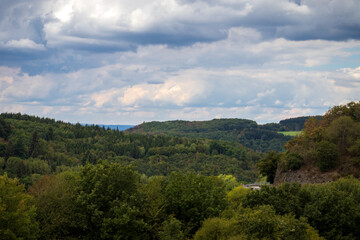 Clouds and green trees on a summer day near Bernkastel-Kues,, Germany.