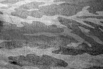 camouflage uniform background with blur effect. in black and white