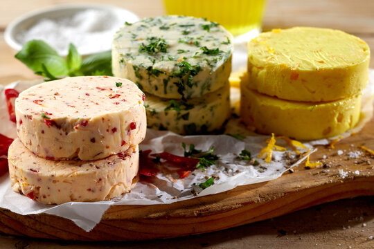 Assorted flavors of savory butter pats