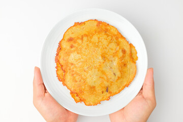 Pancakes with green beans on a white background