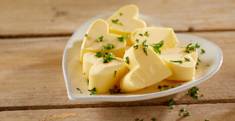 Heart shaped butter pats garnished with parsley