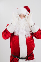 Santa Claus in red clothes, holding glasses with his hands