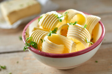 Close up on decorative butter curls in a bowl