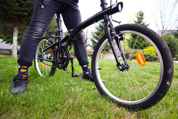 Fototapeta premium Biking on the grass with colorful socks