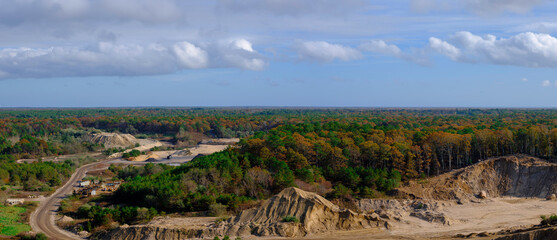 Panoramic Aerial View Cloudscape over Active Quarry in the Forest