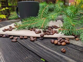 a cup of coffee and a spruce branch