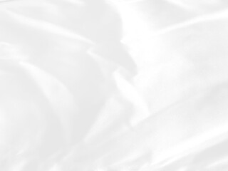 White grey fabric luxurious with a soft wave, abstract blurred background..