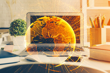 Computer on desktop with social network hologram. Multi exposure. Concept of international people connections.