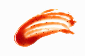 Artistic smear of spicy red jam sauce on white