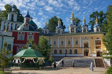 Fototapeta na wymiar Holy Dormition Pskov-Pechersky Monastery. Domes of the Intercession Church, built over the Assumption cave temple
