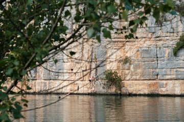Fototapeta na wymiar Young people enjoying and playing at the lake