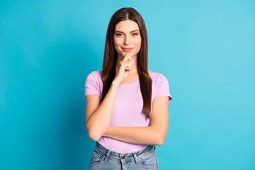 Photo portrait of attractive charming woman wear casual violet t-shirt denim trousers arm finger chin isolated blue color background