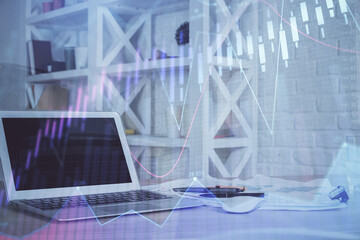 Obraz premium Forex Chart hologram on table with computer background. Double exposure. Concept of financial markets.