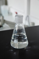 Laboratory or chemistry glassware flask test tube in medical technology research laboratory. Coronavirus or covid-19 vaccine in test tube.