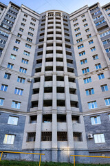 Gray brick facade building city condominium.