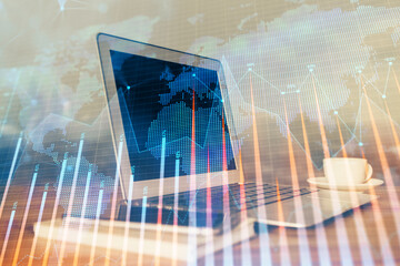 Financial chart drawing and table with computer on background. Double exposure. Concept of...