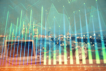 Financial graph colorful drawing and table with computer on background. Double exposure. Concept of...