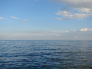 Panorama of the Black Sea coast in a windless evening at sunset.