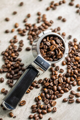 Roasted coffee beans in coffee filter holder