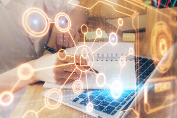 Social network theme hologram over woman's hands writing background. Concept of international people connect. Double exposure