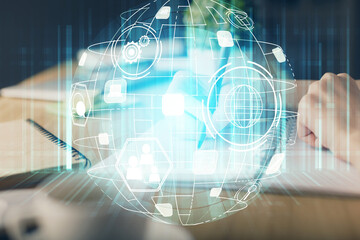 Social network theme hologram over woman's hands writing background. Concept of international people connect. Double exposure