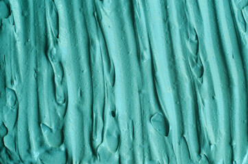 Green cosmetic clay (kelp facial mask, face cream, spirulina body wrap) texture close up, selective...