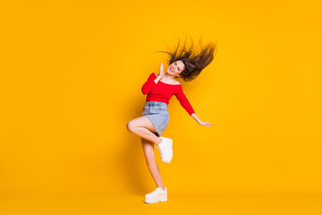 Fototapeta na wymiar Full length body size view of her she nice attractive lovely cheerful cheery thin fit girlish slender girl dancing having fun summertime isolated bright vivid shine vibrant yellow color background