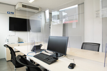Business office room funriture white with desktop and television monitor no people