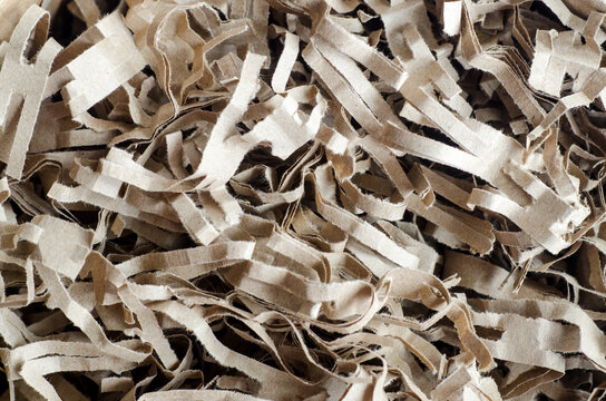 Shredded Brown Paper Packing Material Close Up, Selective Focus. Eco Friendly Recycled Paper Filling For Gift Boxes.