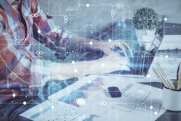 Double exposure of technology hologram with man working on computer background. Concept of big data.