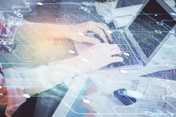 Multi exposure of technology hologram with man working on computer background. Concept of big data.