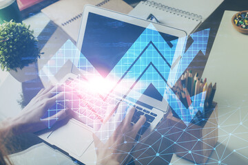 Growing arrows with businessman working on computer on background. Success concept. Double exposure.