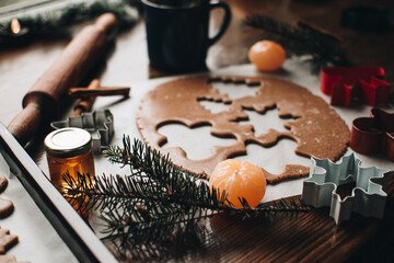 Christmas cookies. Making gingerbread cookies for Holidays. Gingerbread dough. Christmas Baking background. Form for cutting gingerbread. Merry Christmas and Happy Holidays. 