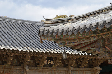 Fototapeta na wymiar Roofs of Tongdosa Temple near Yangsan, South Gyeongsang Province, Korea. Inscription: 龍華殿 