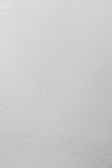 white plaster on the wall close-up, vertical background