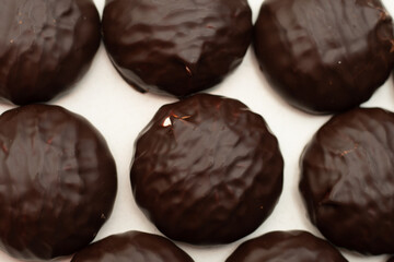 Group of sweets, marshmallows in chocolate isolated on a white background. Top view. Sweet tooth food concept