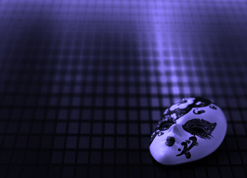 Small Venetian mask on paper.