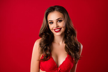 Fototapeta premium Photo portrait of sweet romantic girl smiling isolated on vivid red colored background