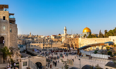 Fototapeta premium Panoramic view of Western Wall Plaza square beside Holy Temple Mount with Dome of the Rock shrine and Bab al-Silsila minaret in historic Old City of Jerusalem, Israel