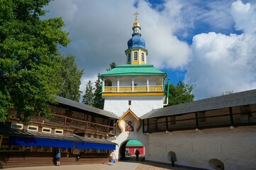 Holy Dormition Pskov-Pechersky Monastery. Nikolskaya gate church on a sunny summer day